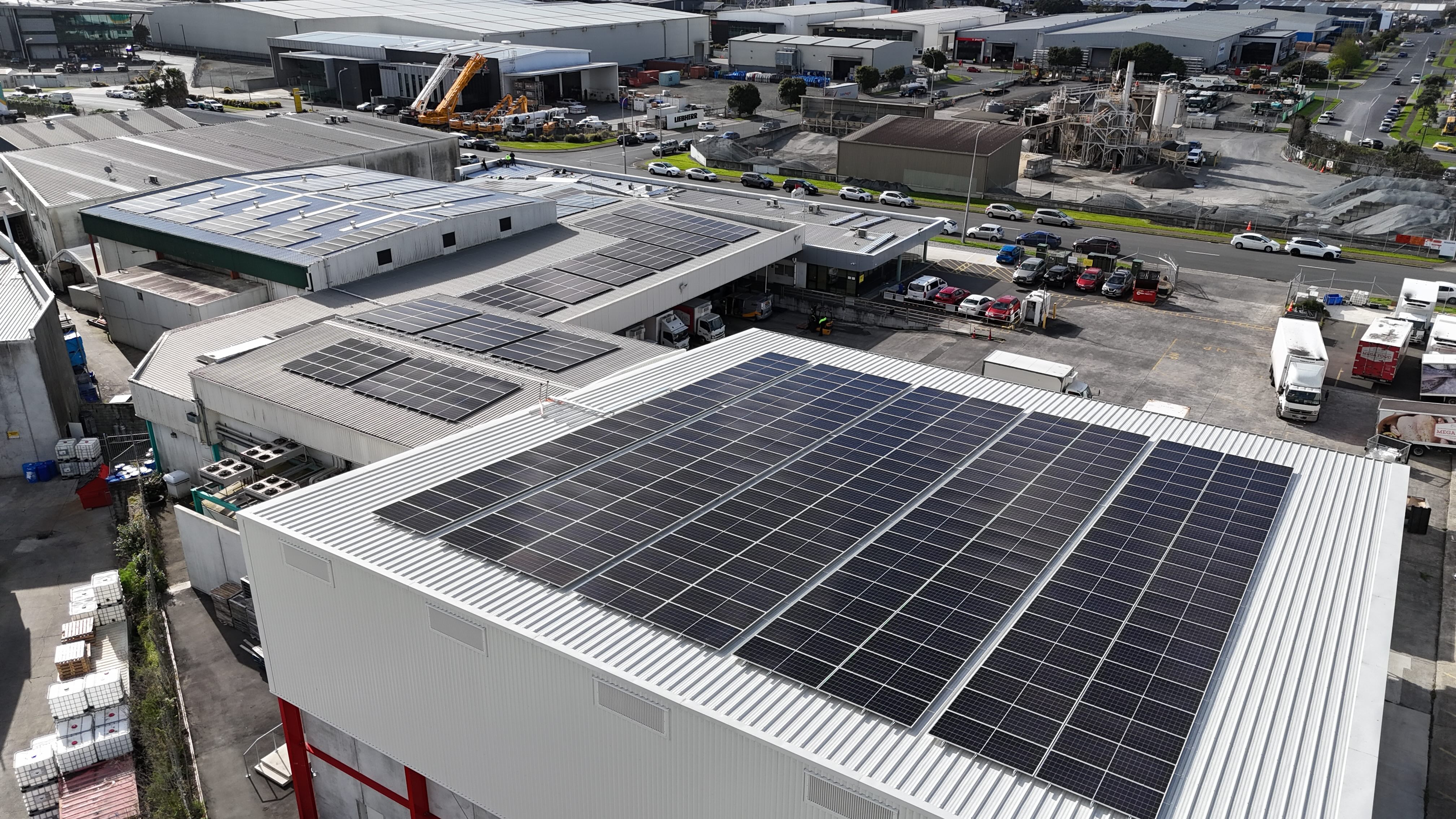 Large commercial solar installation on warehouse roof in Auckland